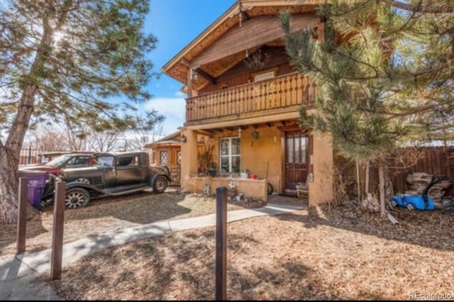 view of front of house with a balcony