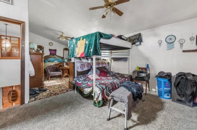 bedroom with carpet flooring, ceiling fan, and vaulted ceiling