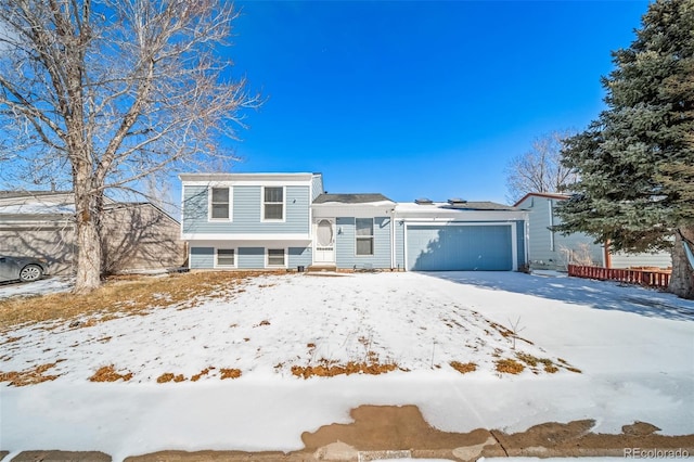 split level home featuring a garage