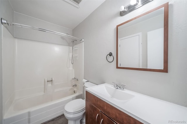 bathroom featuring bathtub / shower combination, vanity, toilet, and wood finished floors