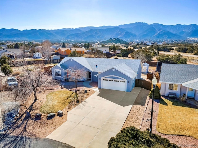 birds eye view of property with a mountain view