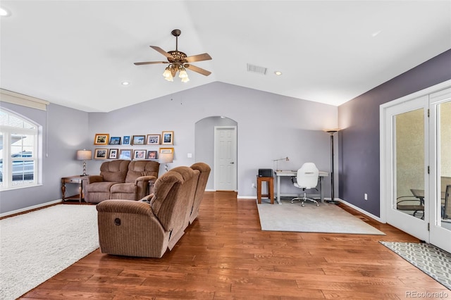 living room with lofted ceiling, hardwood / wood-style floors, and ceiling fan