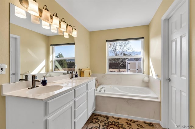 bathroom with vanity and a bathtub