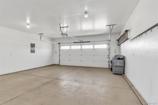 garage featuring a garage door opener and electric panel