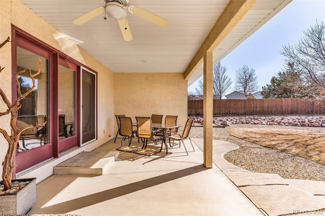 view of patio featuring ceiling fan