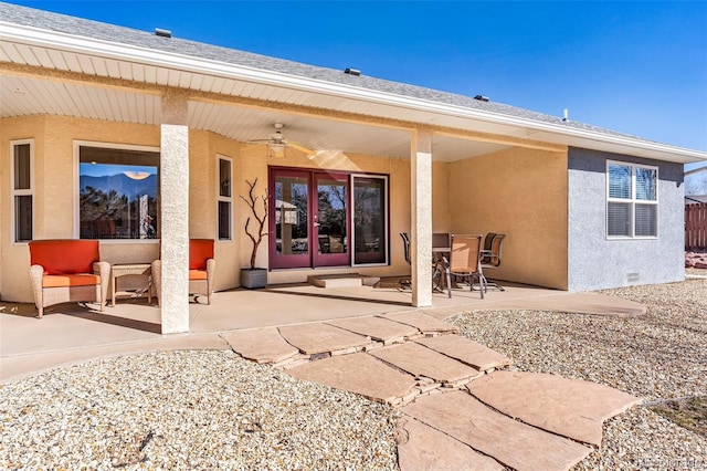 back of property with a patio and ceiling fan