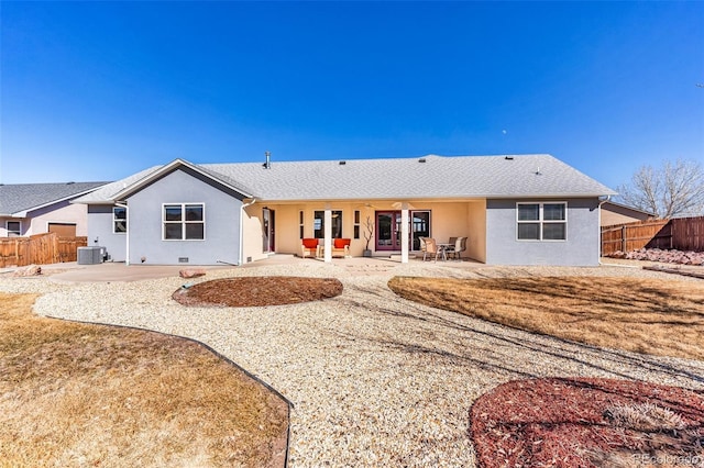 rear view of property featuring central AC and a patio area