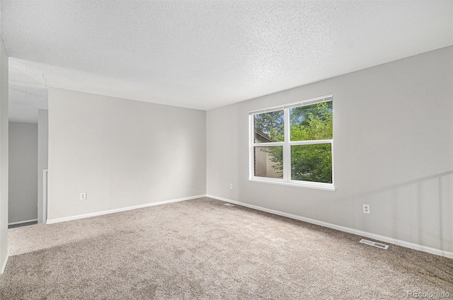 3246 S Nucla St, Aurora, CO 80013 - unfurnished room with carpet flooring and a textured ceiling