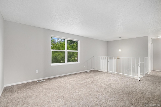 3246 S Nucla St, Aurora, CO 80013 - empty room featuring a textured ceiling and carpet