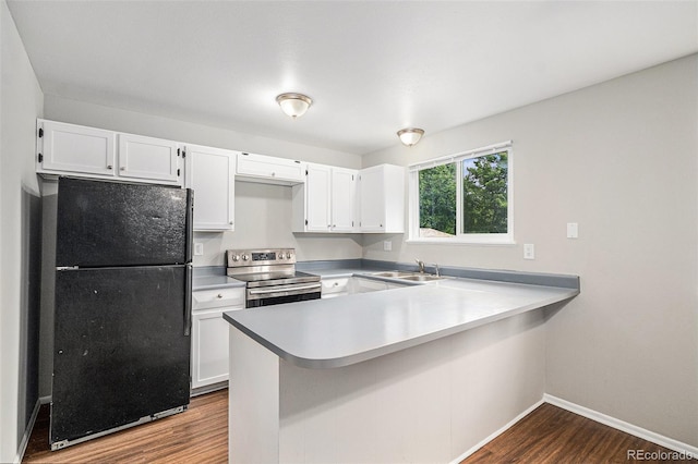 3246 S Nucla St, Aurora, CO 80013 - kitchen with freestanding refrigerator, stainless steel electric range oven, dark wood-type flooring, a peninsula, and white cabinets