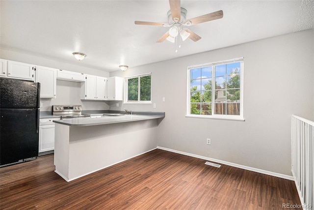 3246 S Nucla St, Aurora, CO 80013 - kitchen featuring freestanding refrigerator, stainless steel electric range oven, dark wood finished floors, a peninsula, and white cabinetry