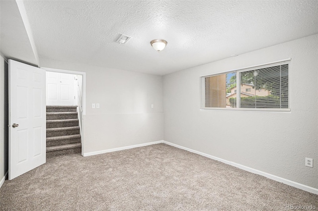 3246 S Nucla St, Aurora, CO 80013 - unfurnished bedroom with carpet floors, a textured ceiling, and a walk in closet