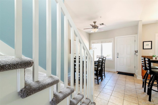2800 Aurora Ave Unit 121, Boulder, CO 80303 - entrance foyer featuring stairway, light tile patterned floors, and ceiling fan