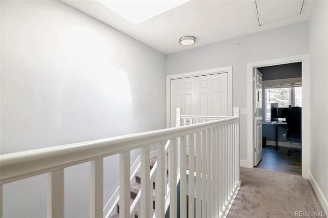 2800 Aurora Ave Unit 121, Boulder, CO 80303 - hall with attic access, light colored carpet, and a desk
