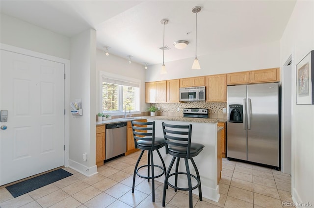 2800 Aurora Ave Unit 121, Boulder, CO 80303 - kitchen featuring stainless steel appliances, light countertops, light tile patterned flooring, tasteful backsplash, and hanging light fixtures