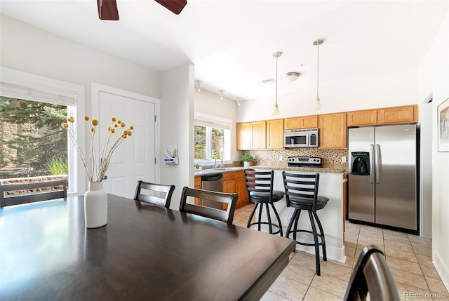 2800 Aurora Ave Unit 121, Boulder, CO 80303 - dining area with light tile patterned flooring and ceiling fan