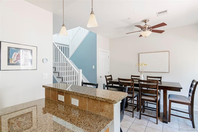 2800 Aurora Ave Unit 121, Boulder, CO 80303 - kitchen featuring ceiling fan, hanging light fixtures, and light tile patterned floors