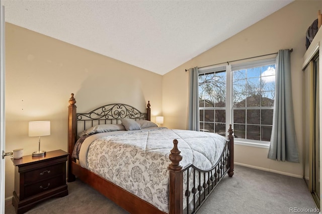 bedroom with carpet and lofted ceiling
