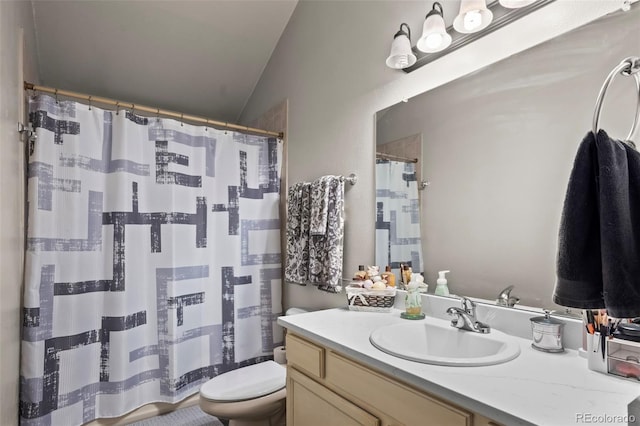 full bathroom with vanity, lofted ceiling, toilet, and curtained shower