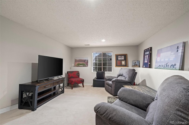 carpeted living room featuring baseboards, recessed lighting, and a textured ceiling