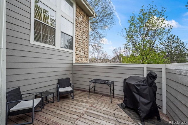 wooden deck with grilling area