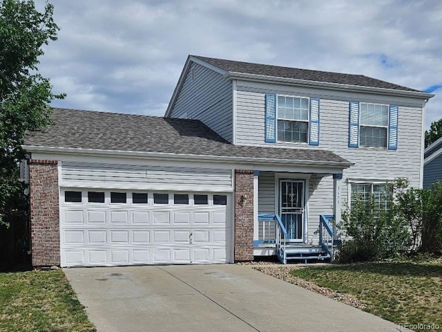 5151 Jasper St, Denver, CO 80239 - traditional home with driveway and a garage