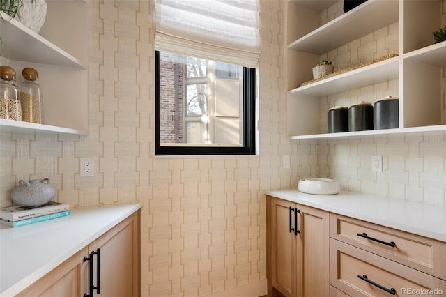 interior space with vanity and tasteful backsplash