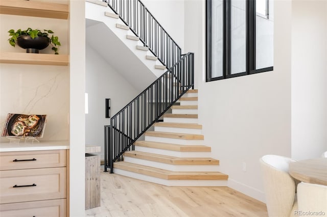 staircase featuring hardwood / wood-style flooring