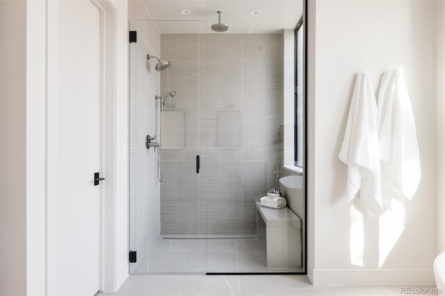 bathroom with tile patterned floors and an enclosed shower