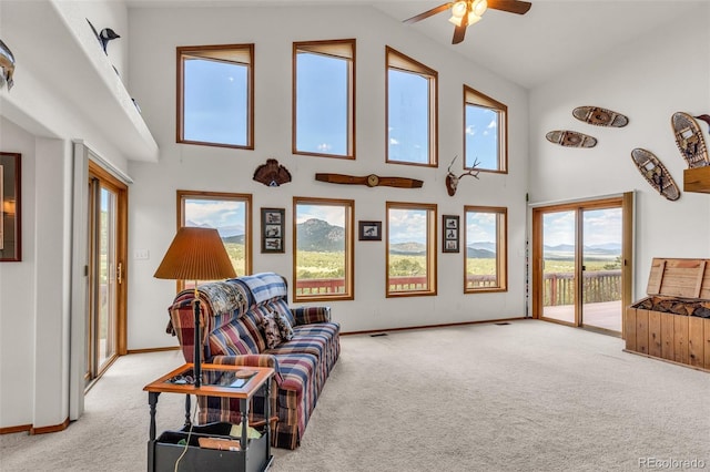 90 Riggs Rd, Westcliffe, CO 81252 - living room featuring light carpet, high vaulted ceiling, and a ceiling fan