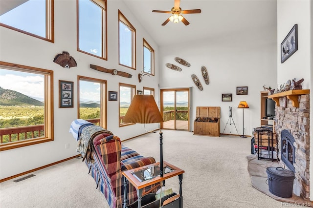 90 Riggs Rd, Westcliffe, CO 81252 - living room featuring carpet floors, high vaulted ceiling, ceiling fan, and a mountain view