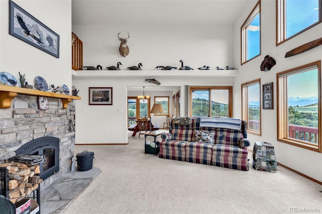 90 Riggs Rd, Westcliffe, CO 81252 - living area featuring carpet floors, plenty of natural light, and a high ceiling