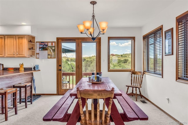 90 Riggs Rd, Westcliffe, CO 81252 - dining area with light colored carpet, a chandelier, plenty of natural light, and recessed lighting