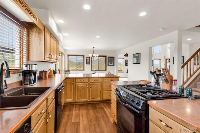 90 Riggs Rd, Westcliffe, CO 81252 - kitchen featuring black appliances, light wood finished floors, a peninsula, healthy amount of natural light, and recessed lighting