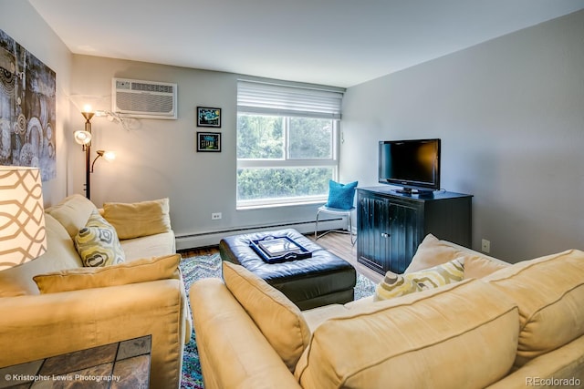 living room with a baseboard heating unit, hardwood / wood-style flooring, and an AC wall unit