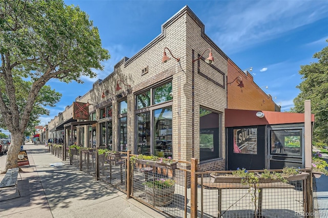 view of building exterior featuring fence