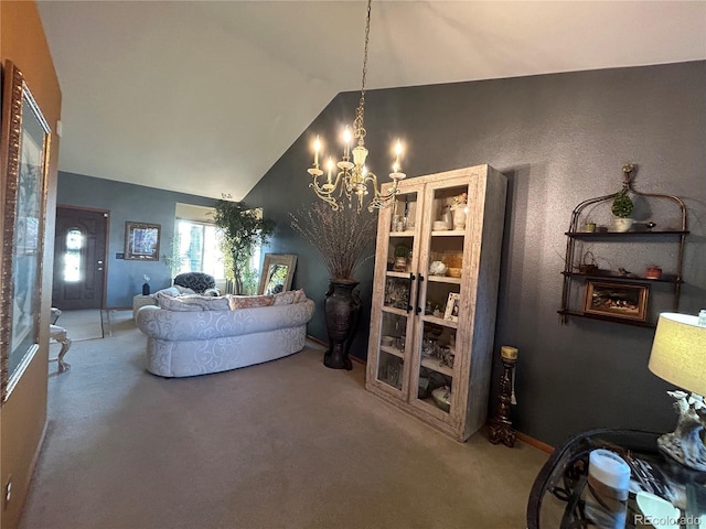 carpeted living room with a chandelier and high vaulted ceiling