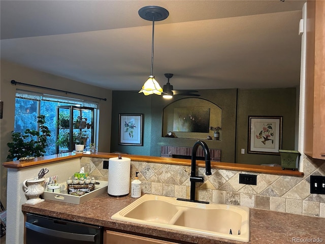 kitchen with decorative backsplash, dishwasher, sink, and ceiling fan