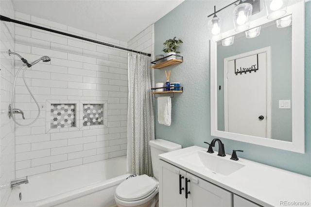 full bath featuring vanity, toilet, shower / tub combo, and a textured wall