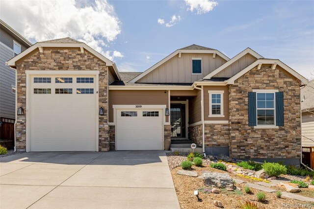 3059 Morningbird Ln, Castle Rock, CO 80109 - craftsman inspired home featuring board and batten siding, stone siding, an attached garage, and driveway