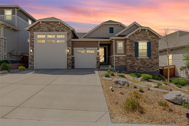 3059 Morningbird Ln, Castle Rock, CO 80109 - craftsman inspired home with board and batten siding, stone siding, an attached garage, and concrete driveway