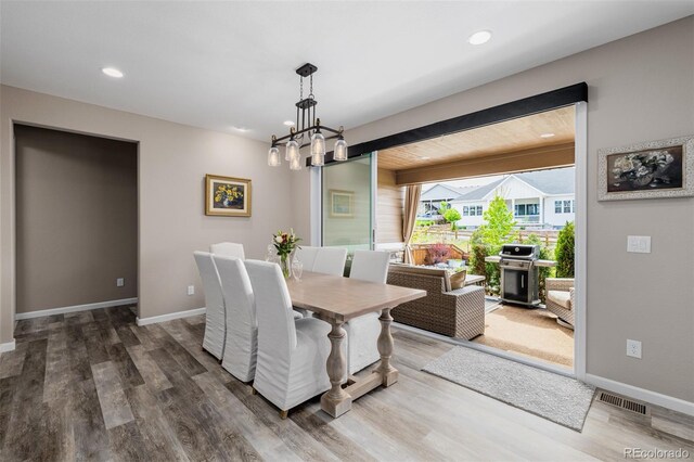 3059 Morningbird Ln, Castle Rock, CO 80109 - dining space with a chandelier, wood finished floors, baseboards, and recessed lighting