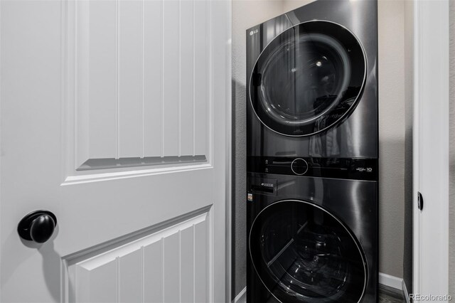 3059 Morningbird Ln, Castle Rock, CO 80109 - laundry area featuring stacked washer / dryer
