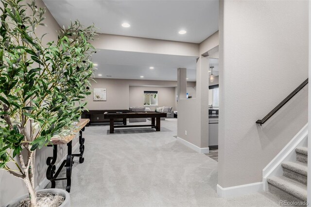 3059 Morningbird Ln, Castle Rock, CO 80109 - rec room with light colored carpet, baseboards, and recessed lighting
