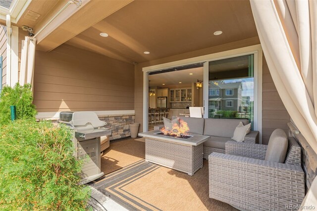 3059 Morningbird Ln, Castle Rock, CO 80109 - view of patio with an outdoor living space with a fire pit
