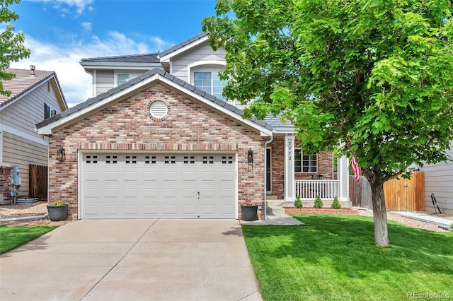 7472 S Memphis St, Aurora, CO 80016 - traditional home with concrete driveway, brick siding, and a tile roof