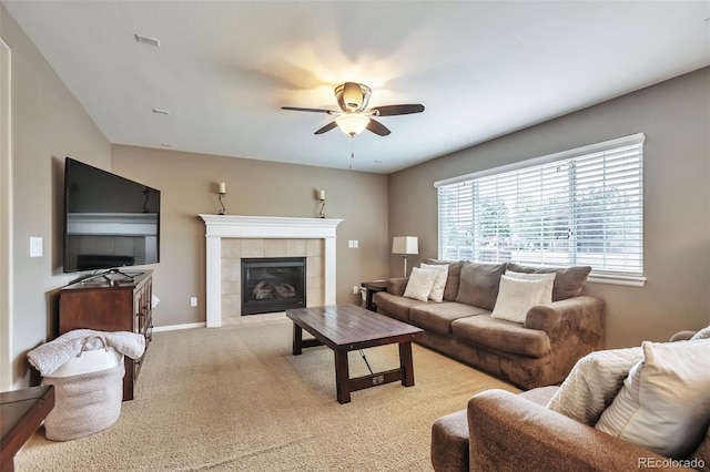 7472 S Memphis St, Aurora, CO 80016 - living room with a ceiling fan, a fireplace, light carpet, and baseboards