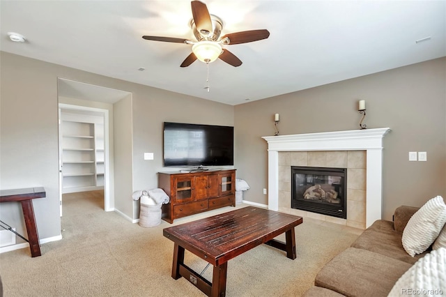 7472 S Memphis St, Aurora, CO 80016 - living area with carpet, ceiling fan, a fireplace, baseboards, and built in features