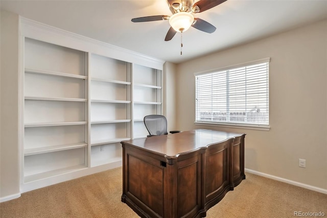 7472 S Memphis St, Aurora, CO 80016 - home office with light carpet, a ceiling fan, and baseboards