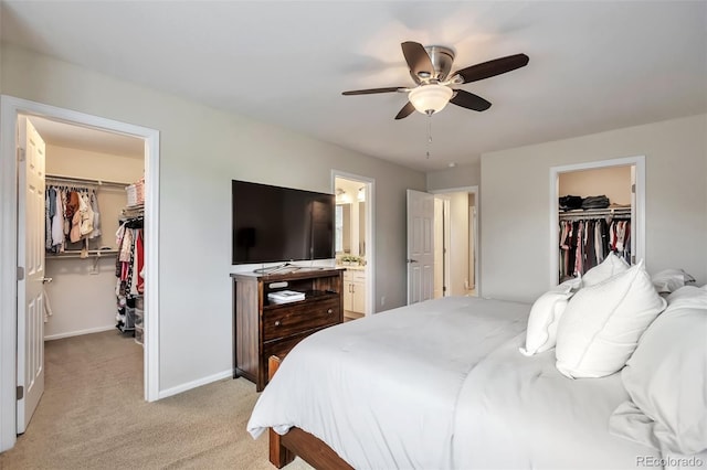 7472 S Memphis St, Aurora, CO 80016 - bedroom with a walk in closet, a closet, light carpet, baseboards, and ensuite bathroom